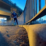 man running fast on bridge